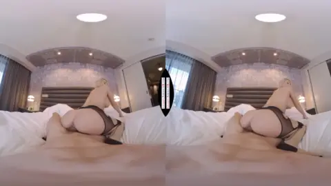 Blonde rides and spreads for close-up pussy shots in a bright bedroom
