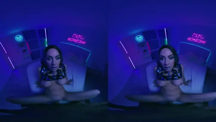 Brunette with tattoos fucks herself on camera in blue-lit bedroom
