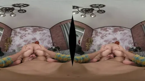 Two curvy redheads and a slim black-haired girl go at it in a bedroom