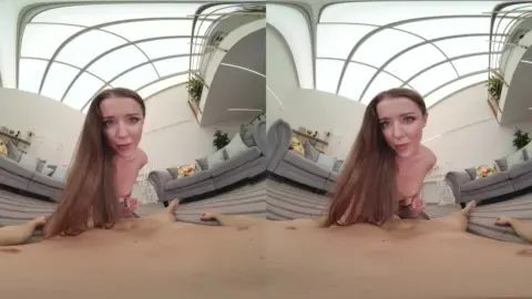 Brown-haired curvy white girl spreads on living room floor with fishne