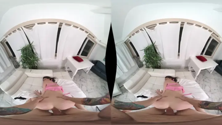 Slim brunette with leg tattoos spreads out on bedroom floor, natural l
