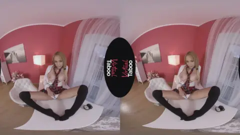 Blonde plays with her breasts on bedroom floor, solo fun