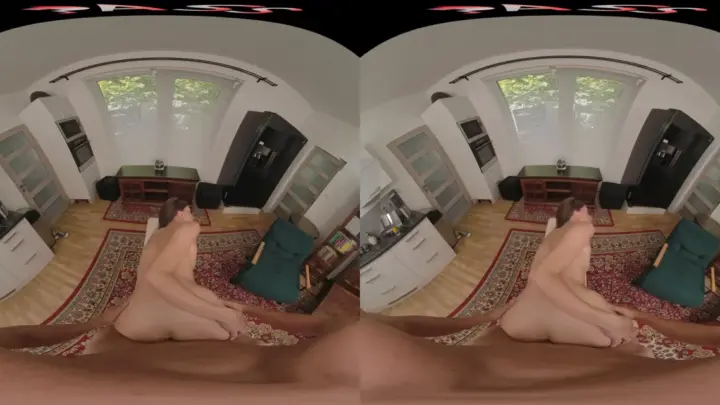 Blonde in living room spreads out on rug, natural light, foot tattoos
