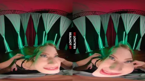 Blonde rides and plays with tits under colored lights