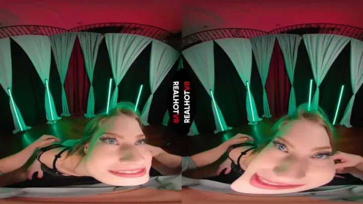 Blonde rides and plays with tits under colored lights