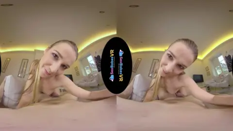 Blonde with tattoos jerks off in bed, legs spread wide on camera