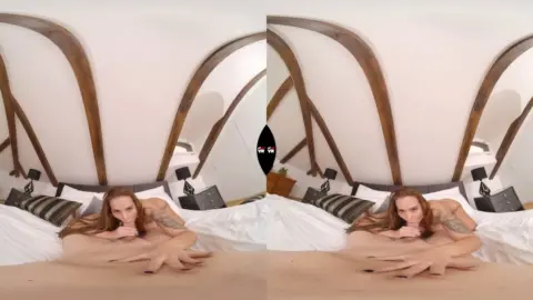 Blonde with tattoos spreads out on bed, plays with herself