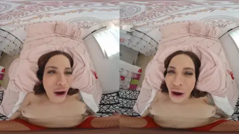 Curvy brunette with tattoos spreads for close-ups on bed