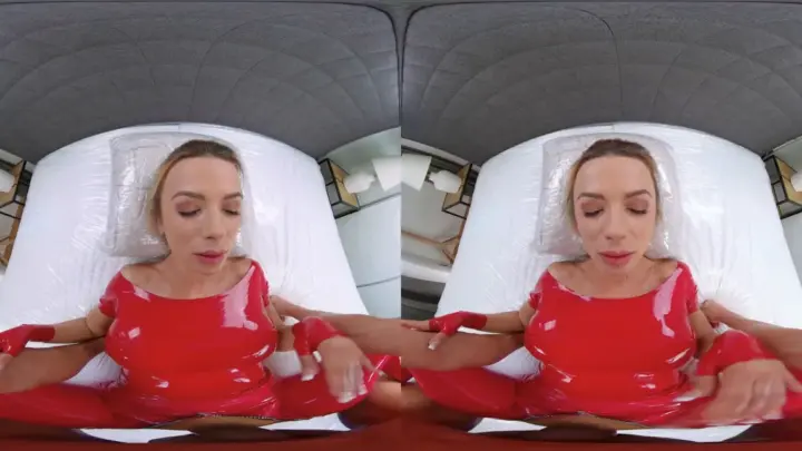Blonde MILF in red latex spreads hard on bedroom floor