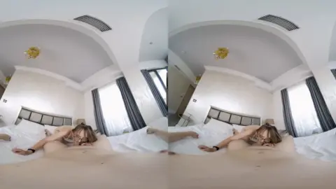 Curvy brunette spreads out on blue rug and bed in 360 view