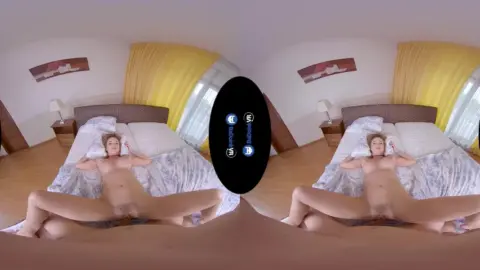 Blonde in fish-eye lingerie spread on stairs and bed