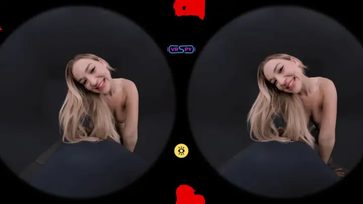 Blonde with piercings bends over and plays with hair on black sheet