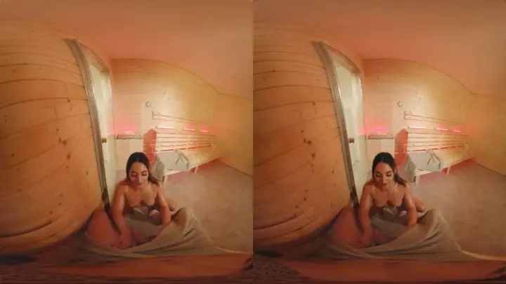 Two brunette women go at it in a red-lit sauna with fisheye lens