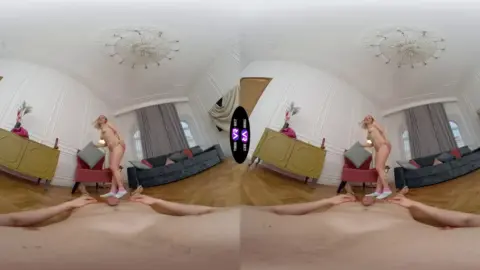 Blonde with neck tattoos spreads out on living room floor