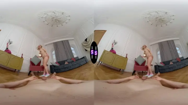 Blonde with neck tattoos spreads out on living room floor