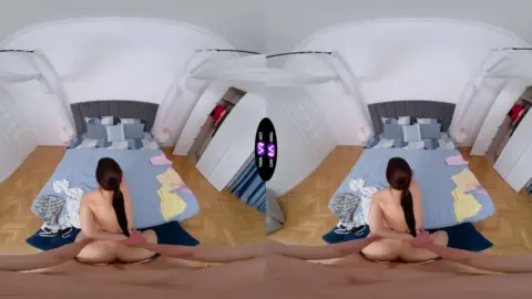 Asian girl with short dark hair gives handjob and gets fucked on bed